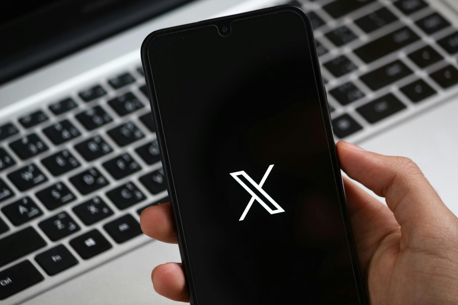Person Holding Smartphone with Modern App Interface